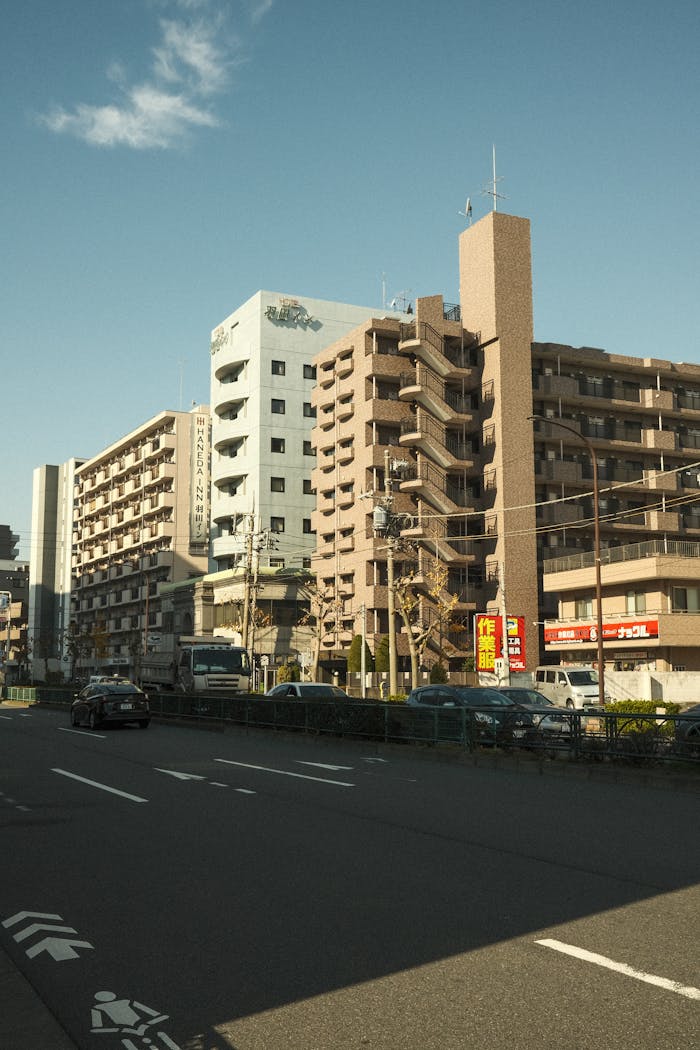 Daytime urban scene with residential buildings and a clear sky in Tokyo, Japan.